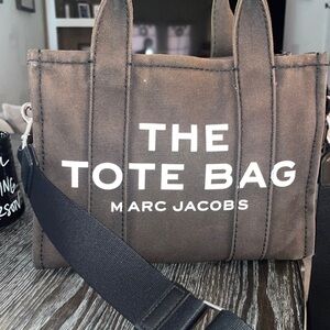 Authentic used as shown discoloration and a minor rip on handle no other damage.